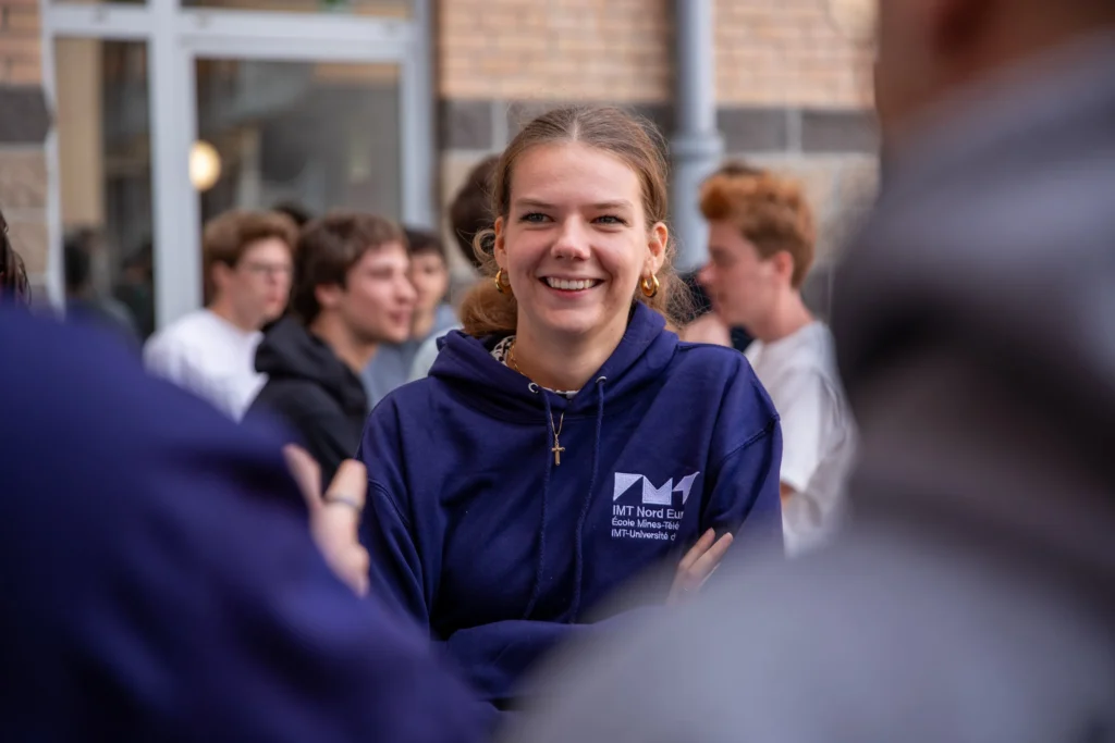 Young woman welcoming new students in IMT Nord Europe