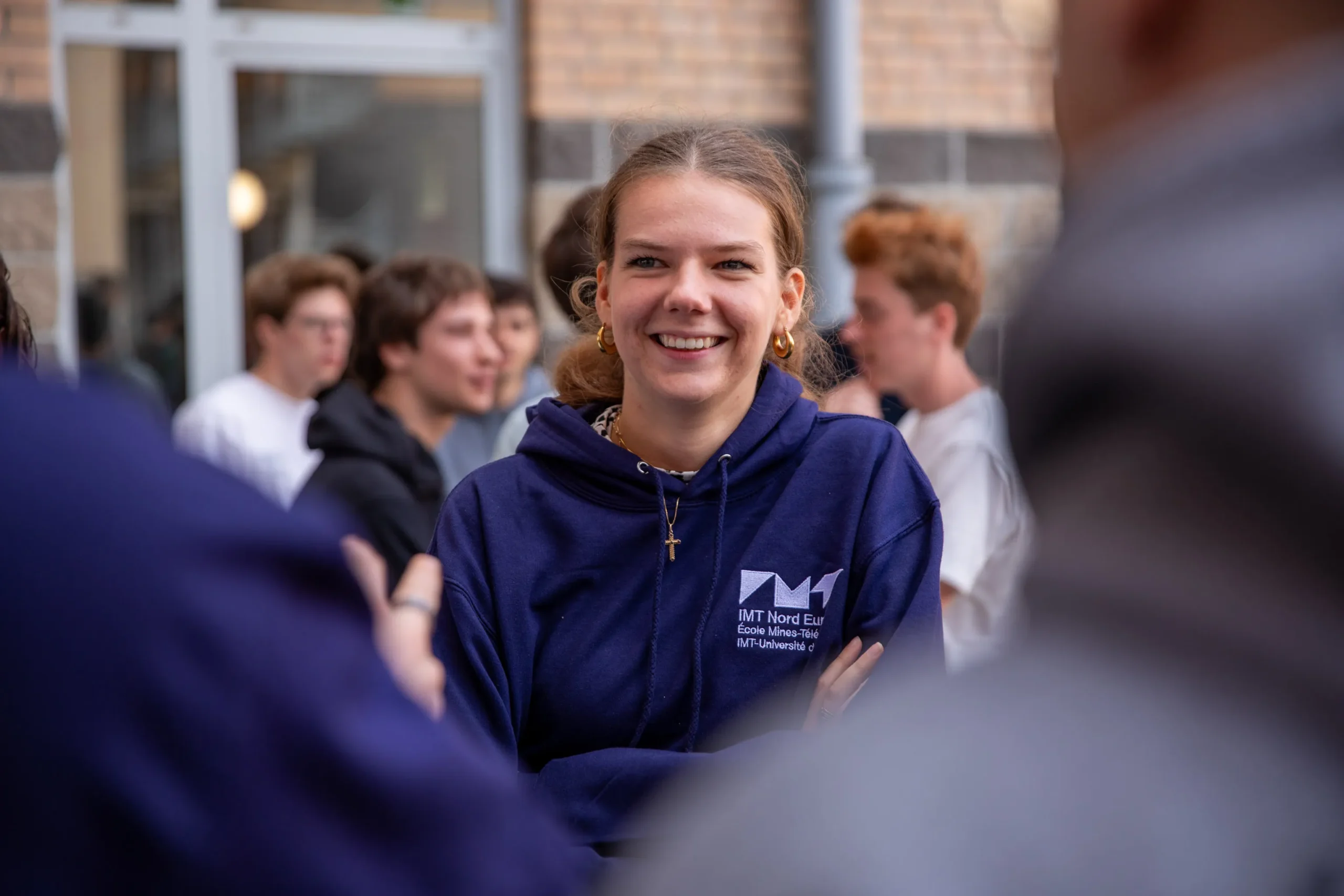Young woman welcoming new students in IMT Nord Europe
